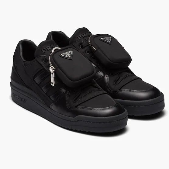 View of all black adidas forum low shoes.
